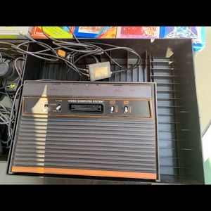 Atari 2600 console, controllers, games, and storage box